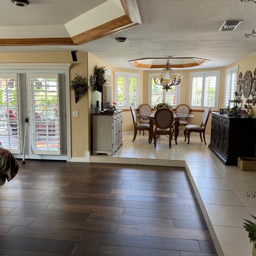 Breakfast room with tray ceiling and French doors
