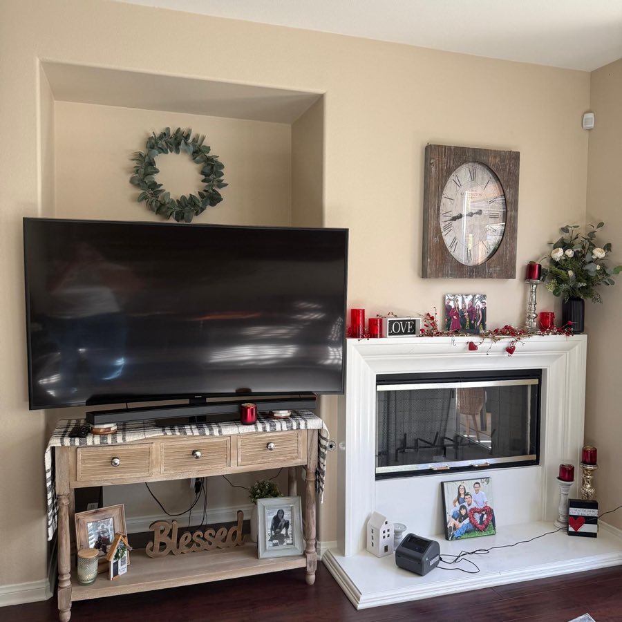 Cleaned living area with fireplace and TV